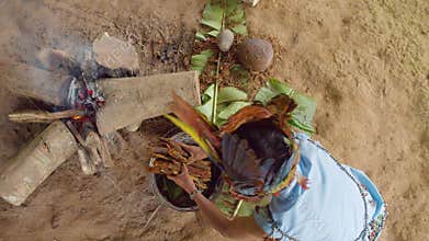 Amazonian indigenous chief cooking ayahuasca
