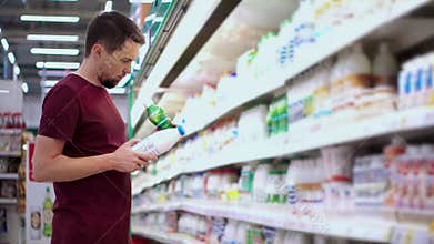 Man buying dairy products in the supermarket
