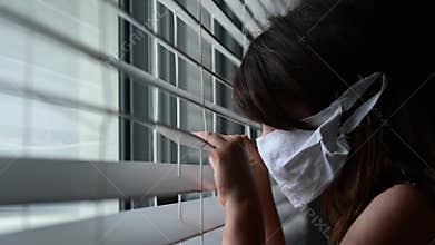 Sad young girl forced to stay at home as the pandemic coronavirus