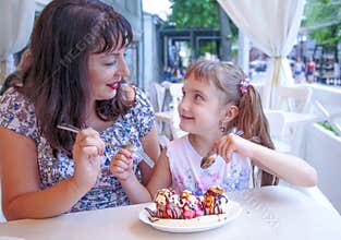 Mother and daughter decided to share one dessert