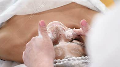 Wellness and beauty salon. Relaxing and health. Spa woman facial massage. Female enjoying relaxing face massage in