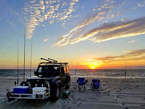 Dewey Beach, Delaware, U.S - September 5, 2020 - A black Jeep equipped with fishing items during early morning sunrise