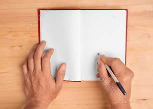 The author signs an autograph