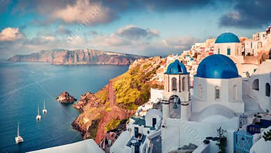 Sunny morning view of Santorini island. Picturesque spring sunrise on the famous Greek resort Oia, Greece, Europe.