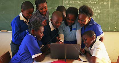 Schoolchildren with laptop in a lesson at a township school 4k