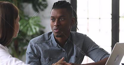 African businessman consultant speak to client inform about offer benefits