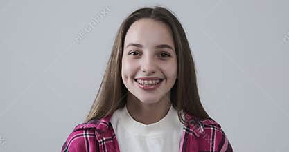 Smiling teen girl over white background