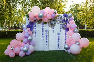 Arch of pink and purple balloons for girl happy birthday party.