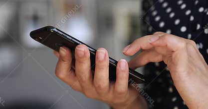 Millennial woman swiping photos in online dating app.