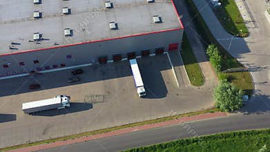 Aerial view of warehouse with trucks