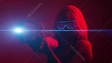 Girl with blaster in the futuristic battle. Concept virtual reality, cyber game.