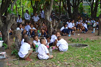 School children brushing their teeth