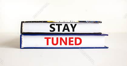 Stay tuned symbol. Concept words Stay tuned on beautiful books on a beautiful white table white background. Business, support,
