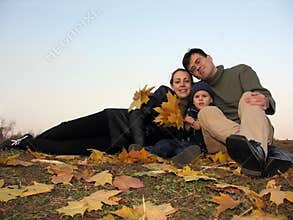 Family with autumn leaves