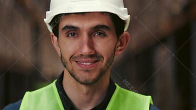 Smiling Supervisor in Special Clothes Working in Factory Looking at Camera. People Portrait. Close Up