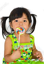 Cute asian baby girl and big lollipop