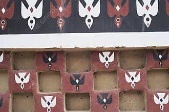 Tucume Peru, replica of the adobe wall in local museum with painted birds
