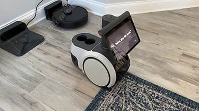 An Amazon Astro Robot moving around in a house
