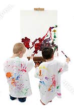 Two Toddler Boys Painting At Easel