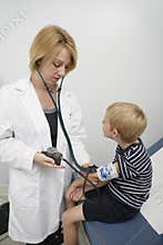 Doctor Checking Boy's Blood Pressure