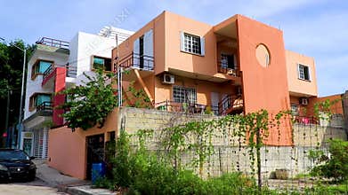 Typical orange residence hotel condominium building Playa del Carmen Mexico