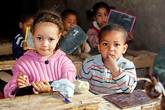 Young school children in a village school somewhere in Morocco.