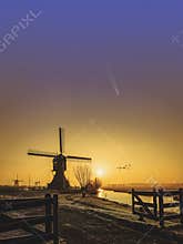 Sunrise with the Neowise comet obove Kinderdijk windmills