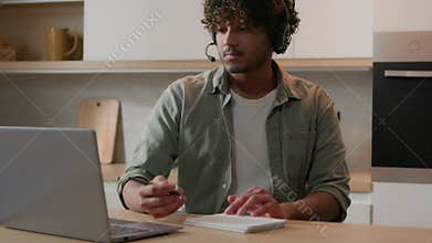 Home education at quarantine self-education Arabian man in headset listen webinar class lesson studying online in