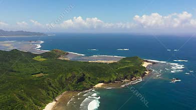 A tropical island and the sea.