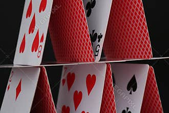 House of playing cards on black background, closeup