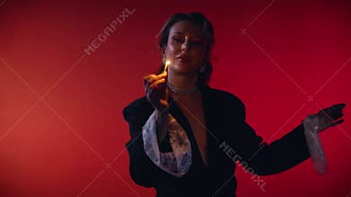 Portrait beautiful woman sexy fashion model posing, lady holding matchbox in hands, lights match, brings flame to lips