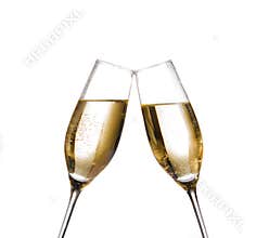 Two champagne flutes with golden bubbles make cheers on white background