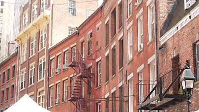 New York City Manhattan building architecture. Red brick house exterior. Real estate property, USA.