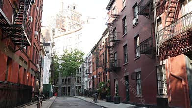 New York City building architecture. Urban residential house exterior. Real estate. Red brick facade