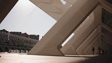 People walking through modern architecture at city of arts and sciences in valencia