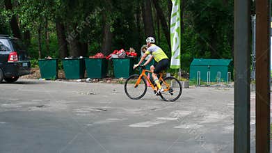 Road Cyclist Riding Bicycle On City Street