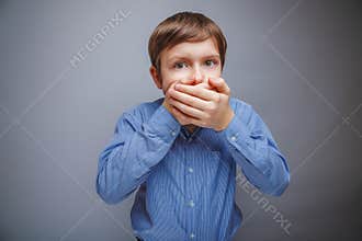 Boy in a shirt covered fright mouth with her hands