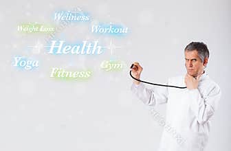 Clinical doctor pointing to health and fitness collection of words