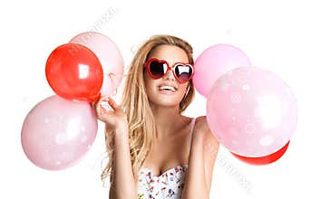 Young beautiful woman with glasses holding red pink balloons, va