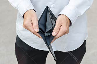Holding a closeup to an empty wallet