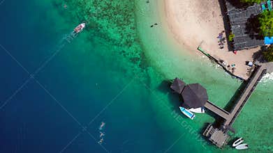 Tropical komodo island beach with people swimming. Great aerial view drone
