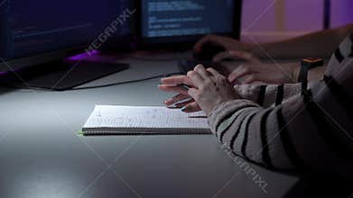 Innovative designers collaborating on prototype development under ambient lighting