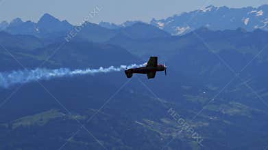 Sukhoi Su 26 Aerobatic Airplane Slow Motion Inverted Pass Over Swiss Alps
