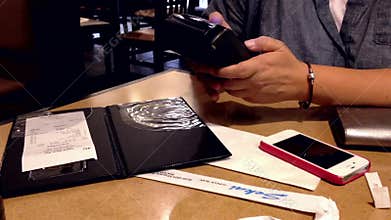 Woman paying bill with credit card