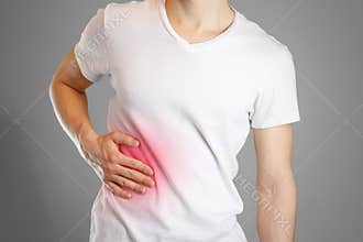 A man holds the liver. Pain in the abdomen. Cirrhosis