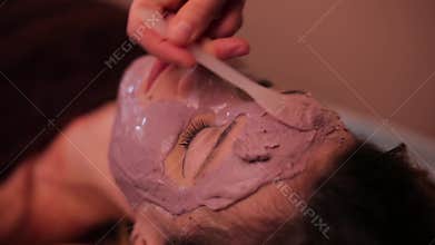 Girl put on a facial mask