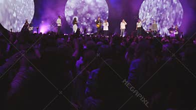 Crowd enjoying concert at night
