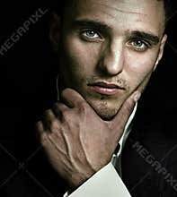 Artistic portrait of handsome man with blue eyes