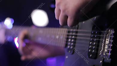 Man playing bass guitar , concert