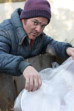 Homeless Man - Digging In Dumpster